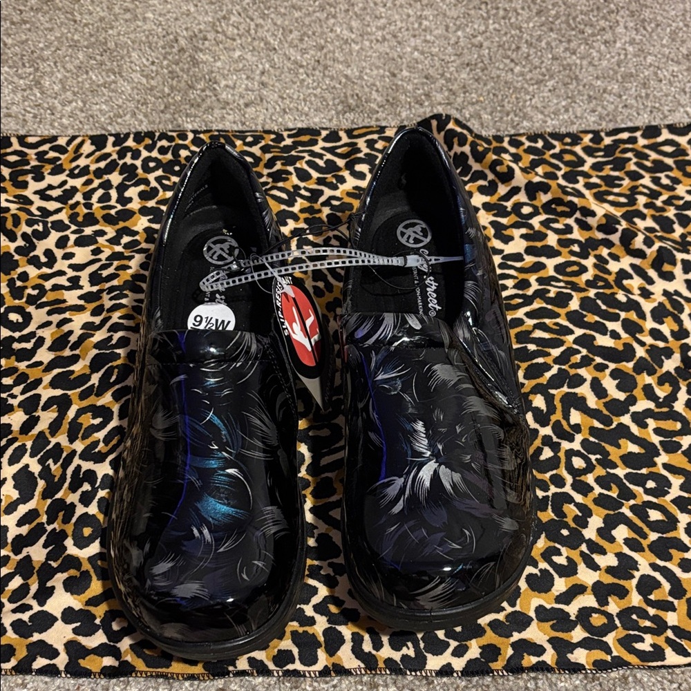 Black Patent Nursing Clogs with Iridescent Feather Print